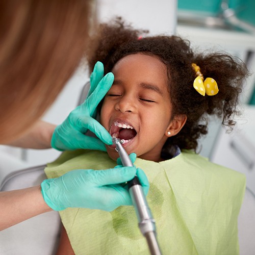 child getting their teeth cleaned at the dentist’s office
