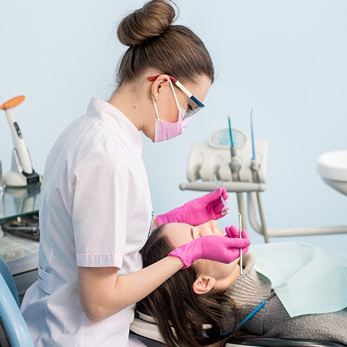 Woman receiving dental exam