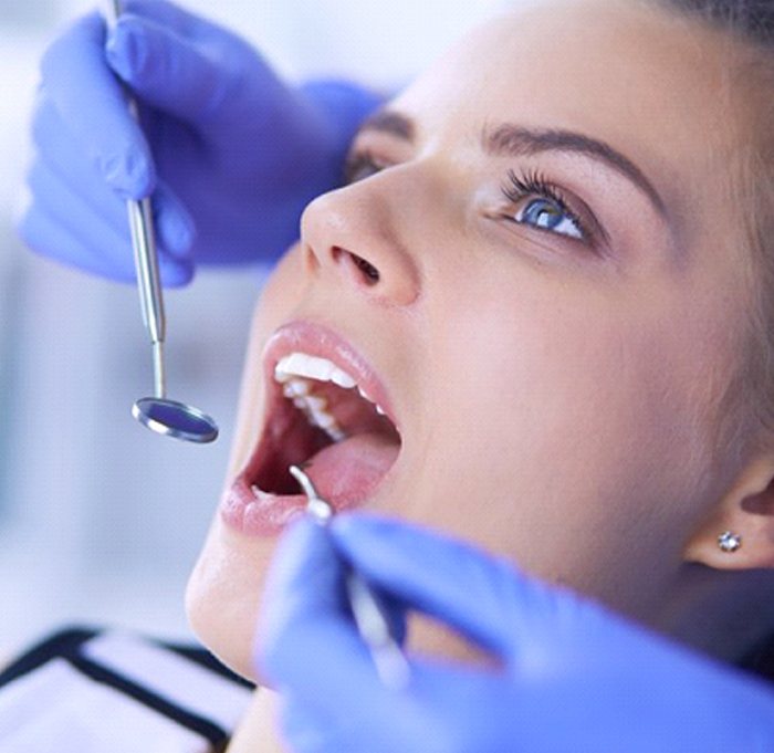 young woman at a dental checkup and cleaning in Indian Land, SC