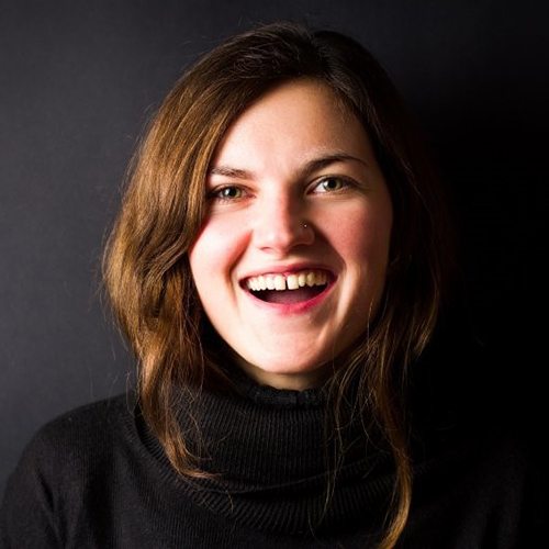 woman in black shirt with gapped front teeth