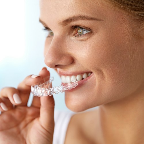 Woman placing Clear Correct tray