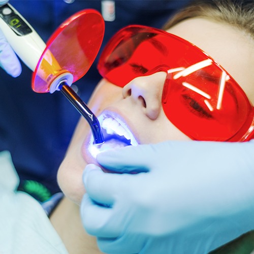 Patient receiving dental bonding treatment