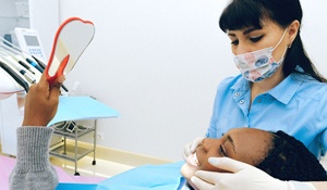 Woman at cosmetic dentist consultation
