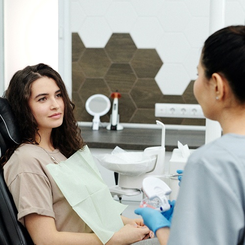 Woman consulting with dentist