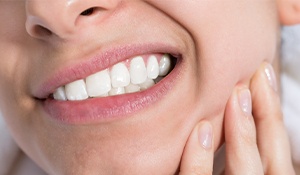 Closeup of person holding jaw