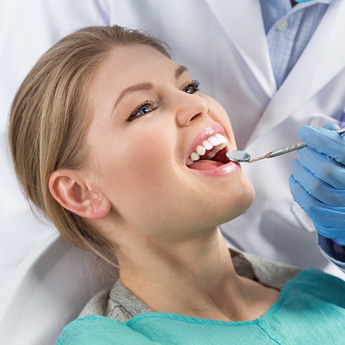 Woman receiving dental checkup