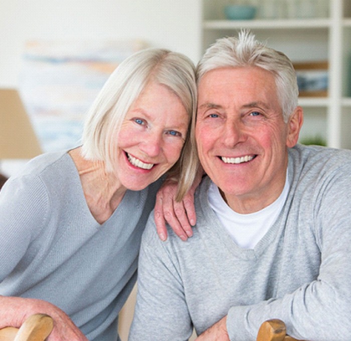 elderly couple smiling 