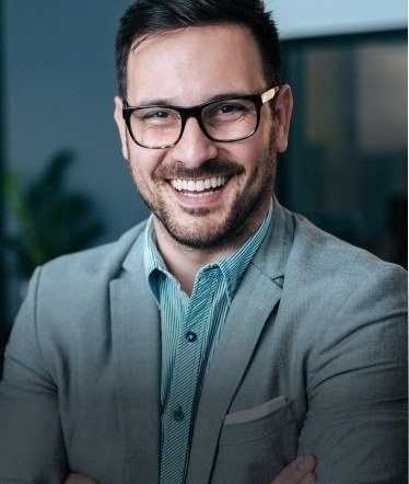 Man in business suit smiling