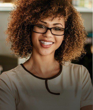 Woman with beautiful smile in glasses