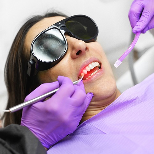 A woman getting laser periodontal treatment