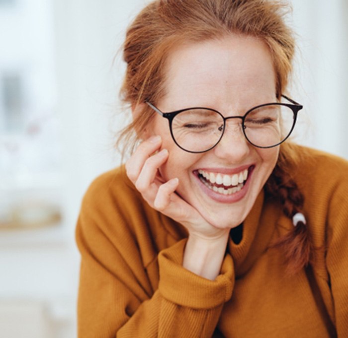 young woman smiling after getting smile makeover in Indian Land