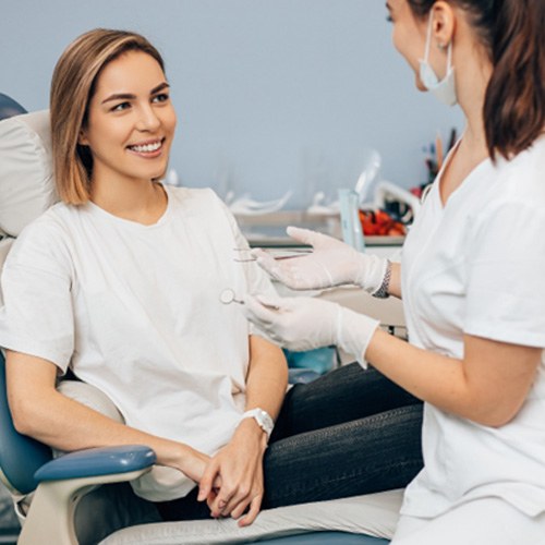 woman smiling during oral cancer screening in Indian Land