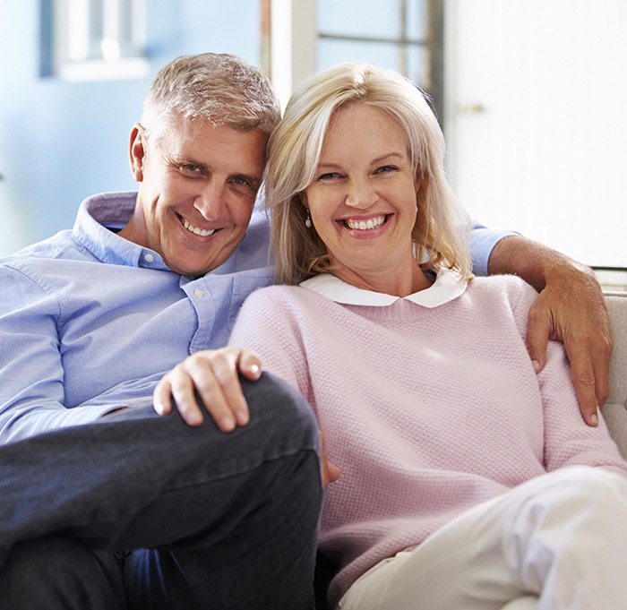 Older man and woman smiling together