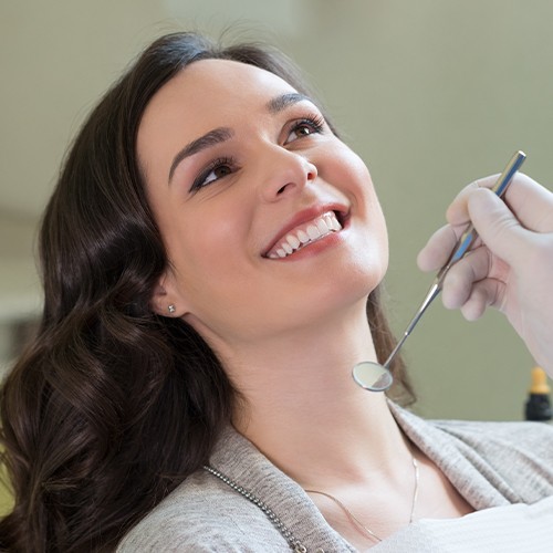 Woman in dental chair during exam