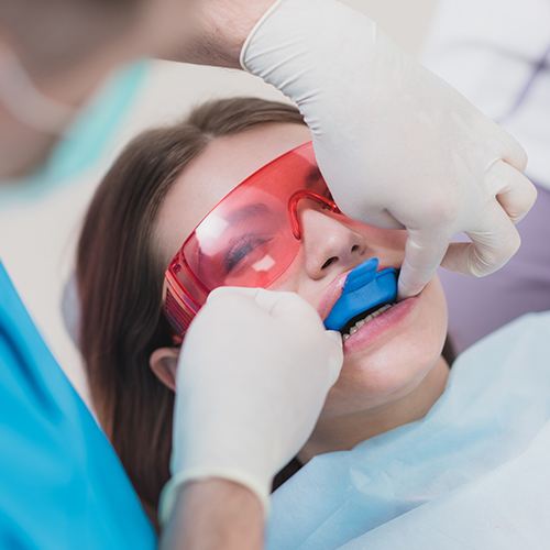 Child receiving fluoride treatment