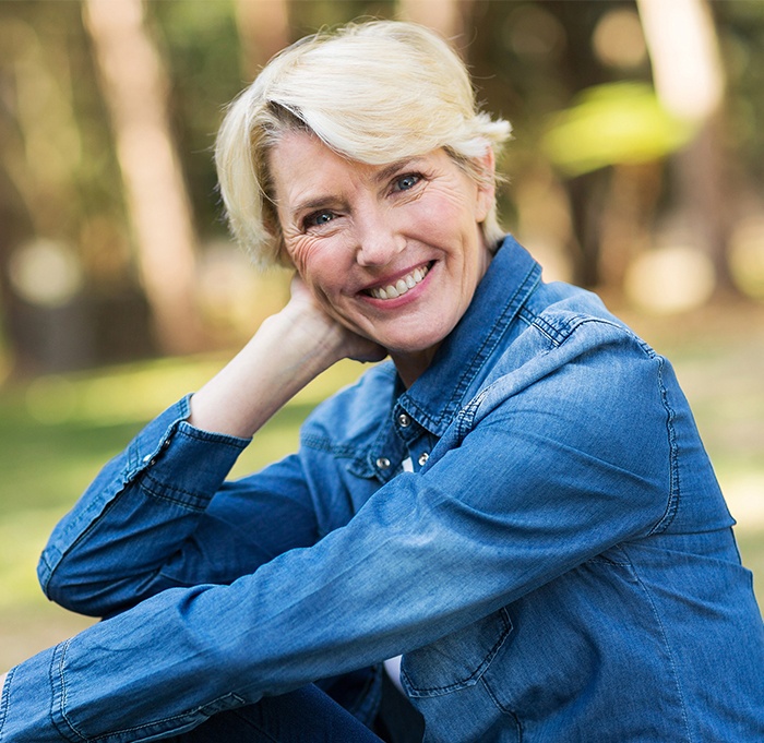 Older woman smiling outdoors