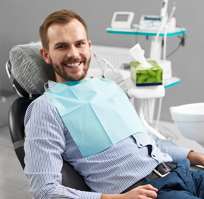 Man in dental chair smiling