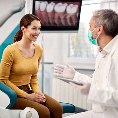 Cosmetic dentist in Indian Island talking to patient