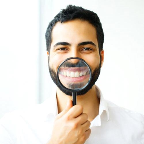 man showing off his smile after getting tooth-colored fillings in Indian Land