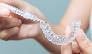 Teeth whitening trays receive gel