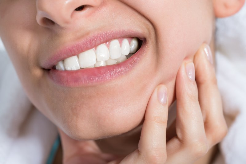 Woman experiencing tooth pain 