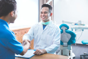 Dentist in Indian Land shaking hands with patient