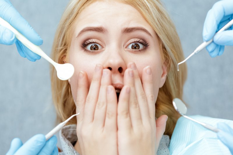 young woman with fear of tooth extractions