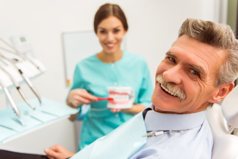 man smiling after getting dentures in Indian Land