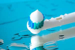 toothbrush with fluoride toothpaste 