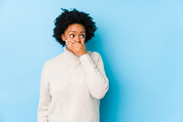 person with stained teeth covering mouth