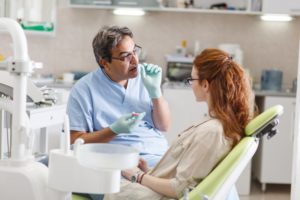 dentist talking to female patient 