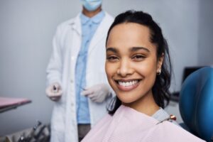 Woman smiling before her gum disease treatment